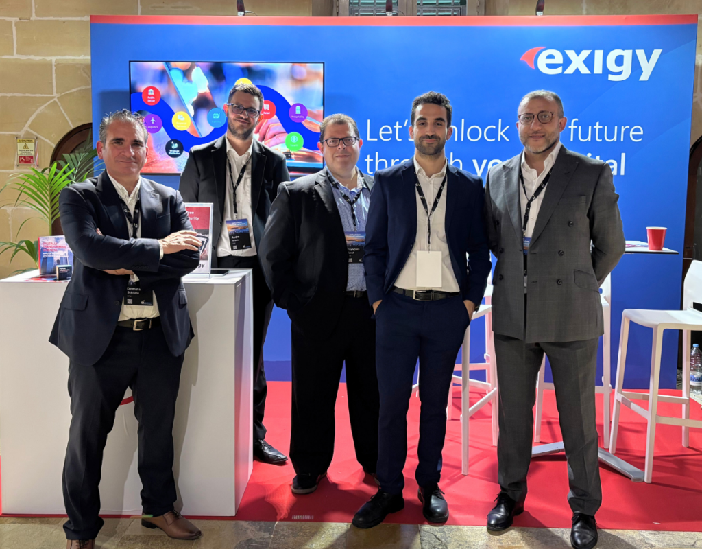 Exigy team members at the company stand during EY Future Realised 2025, held at the Mediterranean Conference Centre in Valletta.